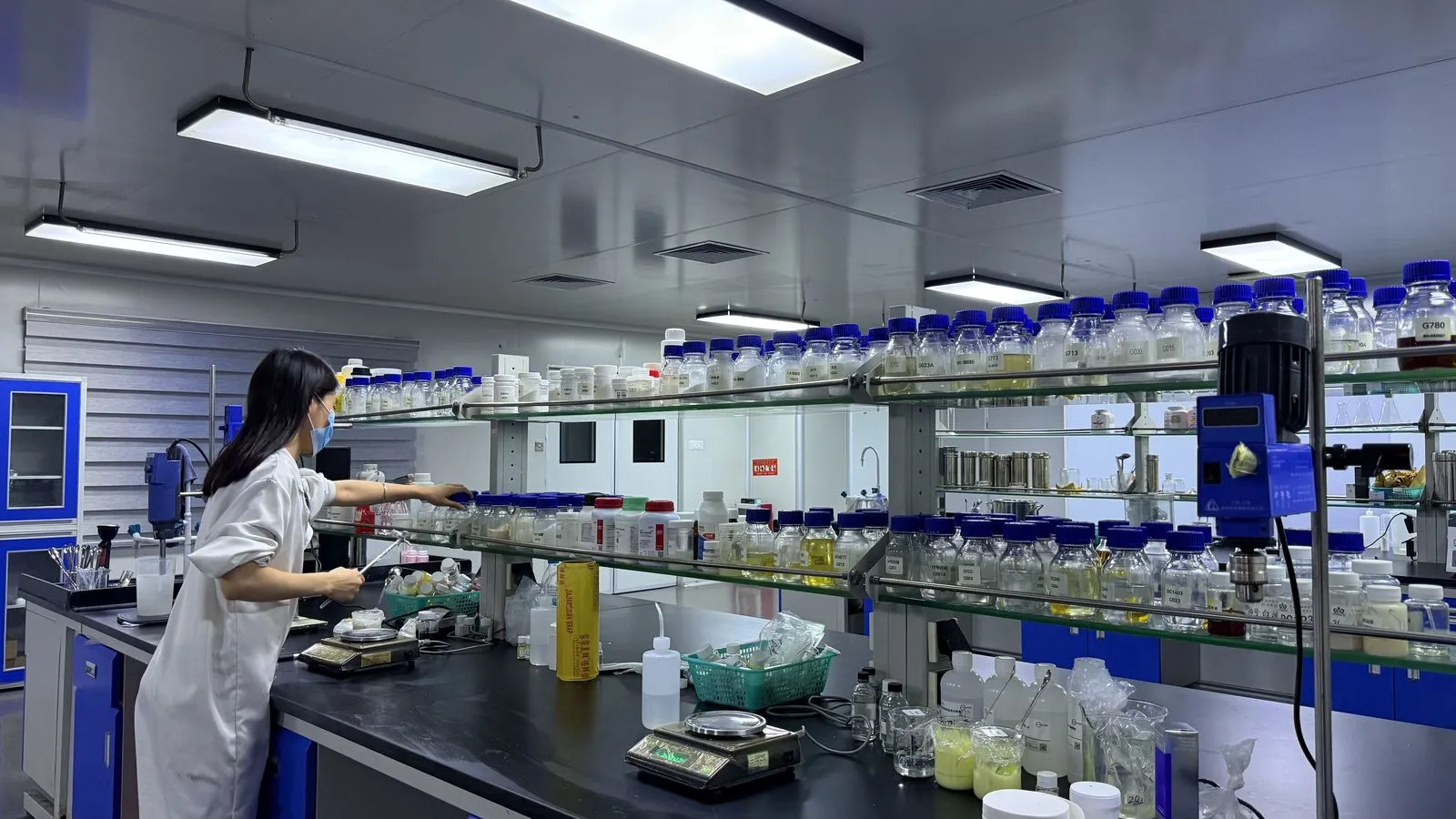 Formulation laboratory bench where sunscreen samples are adjusted against different market filter lists before stability and SPF testing is commissioned