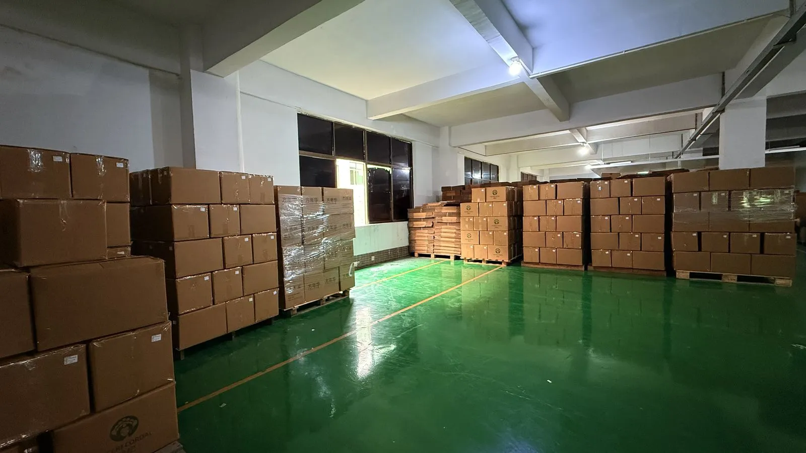 Packaging and labelling stock held at the GZ Cosmetics Lab factory in Guangzhou, where per-variant barcodes and Arabic artwork are checked before a print run for the Saudi market